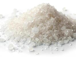 Coarse sea salt heap on white background, perfect for culinary use photo
