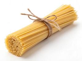 Fresh uncooked spaghetti tied with twine, perfect for pasta dishes photo