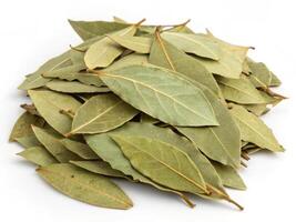 Dried bay leaves in pile, perfect for culinary use and flavoring dishes photo