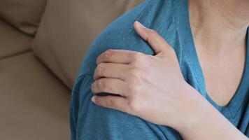 Woman having shoulder pain and neck pain. muscle painful from office syndrome video