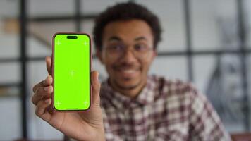 Man Displaying Smartphone with Green Screen video