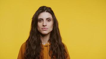 Woman Looking At Camera Portrait with Copy Space on Yellow video