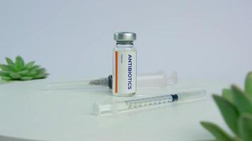 Antibiotics Vial with Syringes and Succulents on rotating display table video