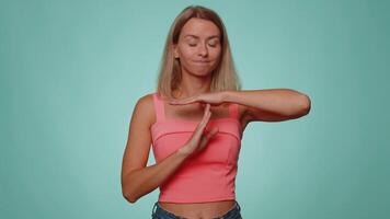 Tired upset woman showing time out gesture, limit stop break sign no pressure I need more time video