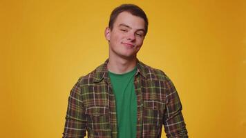 Smiling playful happy man blinking eye, looking at camera with toothy smile, winking and flirting video