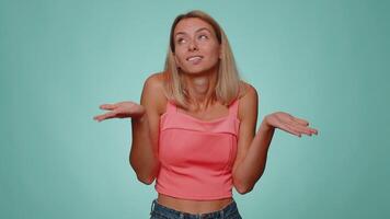 Confused woman feeling embarrassed about ambiguous question having doubts no idea clueless uncertain video