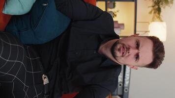 Young bearded man asking why, what reason of failure, demonstrating disbelief irritation by troubles video