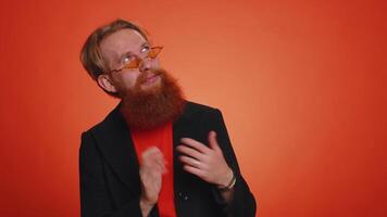 Funny joyful man making playful silly facial expressions, grimacing, fooling around showing tongue video