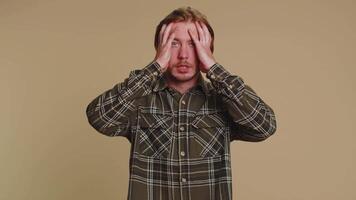Scared fearful depressed man expresses his fear and waves his hands away from danger, waving no video