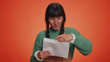 Young nerd student woman open envelope letter, great news, celebrate, monetary award, invitation video
