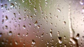 Drops on glass. Rain on glass window from indoors. Rain on glass. Raindrops of water on window background. Bad weather. Macro shot. video