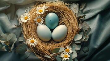 Easter eggs placed in a nest, surrounded by eucalyptus leaves and flowers video