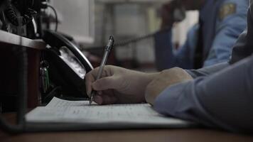 Close-up of hands men write Notepad at work video