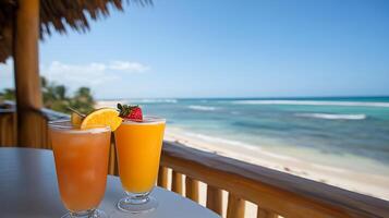 Two colorful cocktails on a table with a beach view. photo