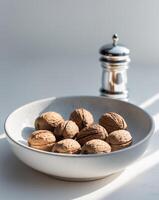 Closeup of Walnuts in Bowl with Nutcracker. photo