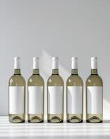 six bottles of wine with a blank label on them. photo