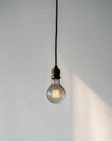 there is a light bulb that is hanging from a wire. photo