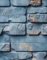 Weathered blue stone brick wall with textured surface suitable for web design backgrounds or mobile applications. photo