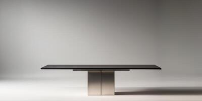 A table with a silver base and a black top photo