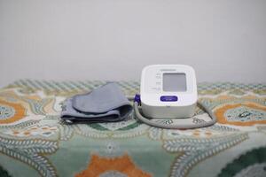Lampung Selatan, september 13, 2024, Blood Pressure Monitor on patterned surface photo