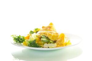 Ideal breakfast. egg roll with sweet pepper and salad, isolated on white background photo