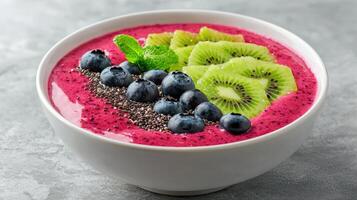 Healthy Food Revolution, Smoothie bowl with vibrant toppings of sliced kiwi, blueberries, and chia seeds photo