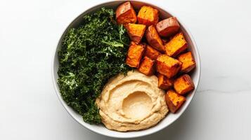Healthy Food Revolution, A vibrant mix of roasted sweet potatoes, kale, and creamy hummus photo