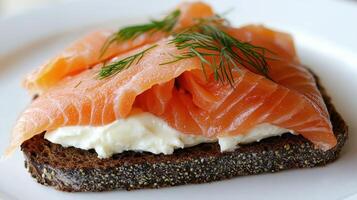 Healthy Food Revolution, Open-face sandwich with smoked salmon, dill, and cream cheese on dark rye bread photo
