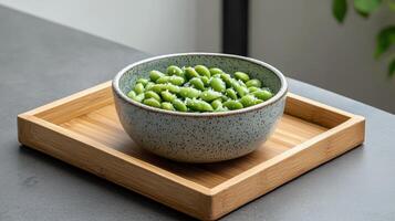Healthy Food Revolution, Small bowl of edamame beans sprinkled with sea salt photo