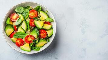 Healthy Food Revolution, Vibrant bowl of quinoa salad with avocado, cherry tomatoes, and fresh herbs photo