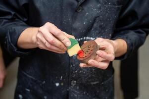 Hands crafting artistic block print with intricate patterns photo