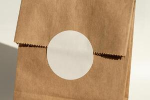 Plain brown paper bag with circular label photo