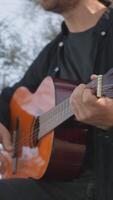 Playing the Guitar to Distract from the Daily Routine in a Park video