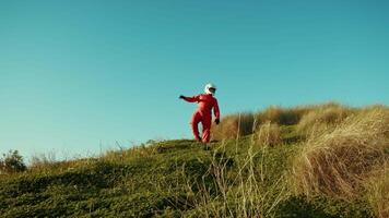 Astronaut Goes Down A Hill Into The New Planet Vegetables Exploration video