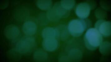 Motion Graphics Emerald Bokeh Abstract backdrop of soft, ethereal green bokeh circles, resembling distant twinkling lights or blurred natural elements. Perfect for a calming, serene, and elegant aesth video