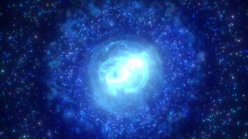 A vibrant blue nebula sphere with a bright core, surrounded by shimmering particles video
