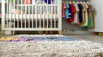 Cozy nursery focus transition with soft textures and colorful clothes video
