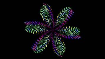 A mesmerizing pattern of glowing purple and green flowers arranged in a circular shape on a black background. A captivating and vibrant visual spectacle video