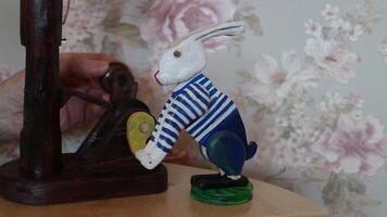 rabbit puppet, turns handle with sound video
