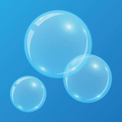 Bright blue soap bubbles isolated on blue background close up