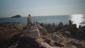 Rock balancing art on a hill by the beach on Koh Samed Island Rayong, Thailand video