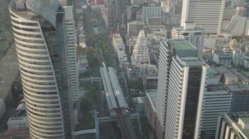 BTS Skytrain and Skyscrapers in Sathorn and Silom, Bangkok financial districts with impressive architecture. video