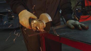 Precision Metal Cutting with an Angle Grinder in a Workshop for Quality Craftsmanship. Media video
