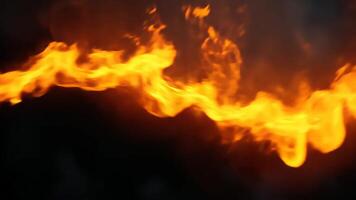 Intense orange and yellow flames flow dynamically across a dark background Perfect for fiery intros or dramatic effects video