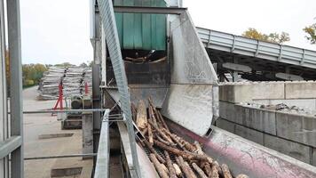 Industrial Facility with Log Processing and Autumn Trees in Background video