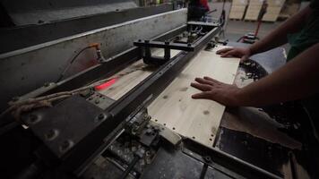 Person Operating Woodworking Machine with Laser Guide in Workshop video