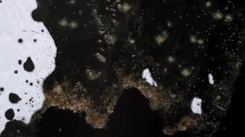Snow Covered Surface with Dark Textured Frozen Terrain Patterns video