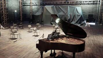 Old opera house setting with a grand piano and empty chairs for performance video