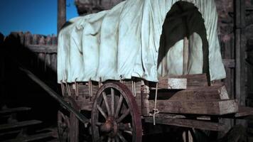 Exploring a vintage covered wagon resting in an old western setting video