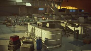 Abandoned airport terminal with scattered luggage and empty check in counters video